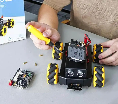 Building AI Smart Robot Kit With Mecanum Wheel For UNO R3 ESP32 Camera App Control FPV Video on table, ideal for STEM education