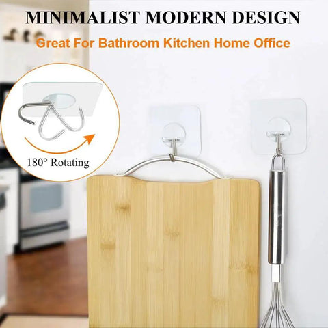 Two clear Heavy Duty Adhesive Hooks Up To 15 Lbs With 180 Degree Rotating Design holding kitchen utensils on a wall.