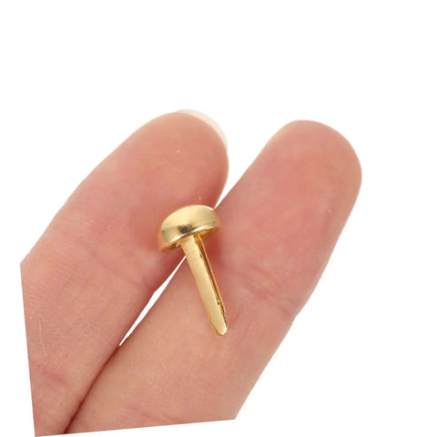 Close-up of a brass brad nail from 200Pcs DIY Craft Nails For Wall Hangings And Scrapbooking Kit With Miniature Tacks Decor Brads