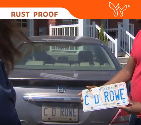 Person holding a license plate with Clear 2 Pack License Plate Cover For Your Ride Weather Resistant Unbreakable Protector.