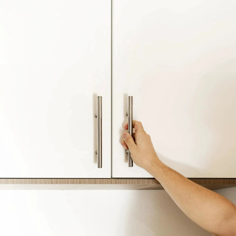 Person opening cabinet with 4 Inch Satin Nickel Truss Bar Cabinet Pulls 10 Pack Center To Center 104 mm