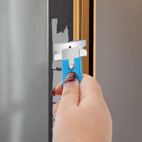 Hand using Retractable Box Cutter Utility Knife 12 Pack All Metal Shell Single Edge Blades to remove paint on door frame