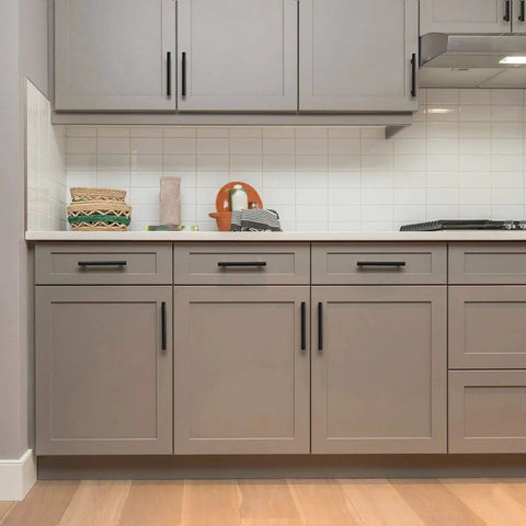 Modern kitchen with 30 Pack 5 Inch Cabinet Pulls Matte Black Stainless Steel Kitchen Drawer Pulls on gray cabinets.