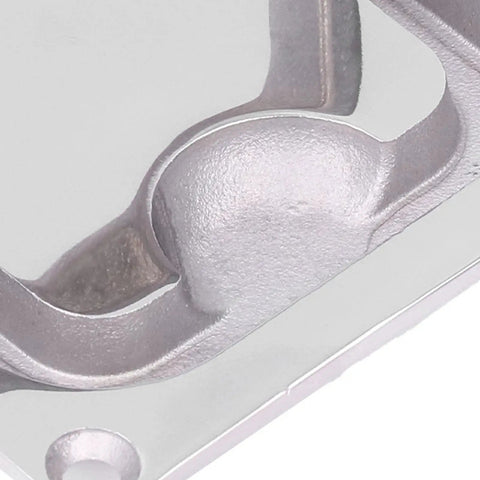 Close-up of RiToEasysports stainless steel central console elevation button, raised round metal button on automotive interior bezel