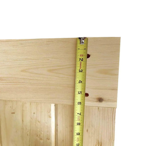 Close-up of Unfinished Solid Pine Core Interior Barn Door Slab DIY Kit 84 In By 18 In Pre Drilled For Hardware showing wood texture.