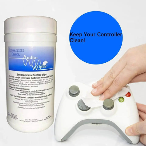 Hand cleaning gaming controller with Hearing Aid Cleaning Towelettes Kit With 160 Wipes And Battery Keychain container nearby