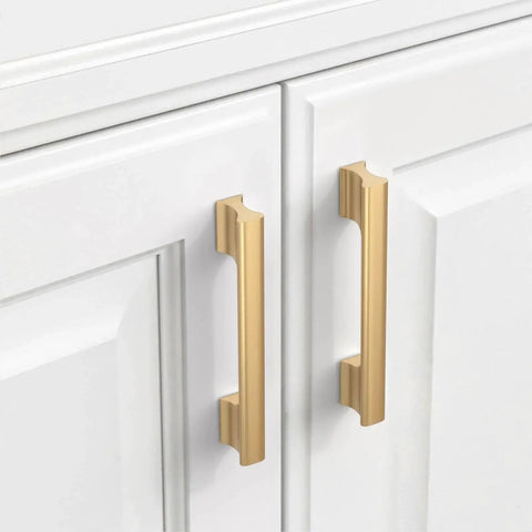 Champagne Bronze Cabinet Pulls 5 Inch Center To Center, 10 Pack Zinc Alloy Cabinet Handles installed on white cabinet doors.