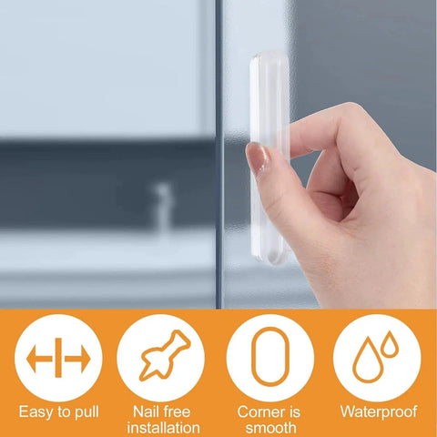 Mini Self Adhesive Clear Acrylic Cabinet Drawer Pulls 2 Pack No Punching Design Push Pull Handles attached to a glass panel