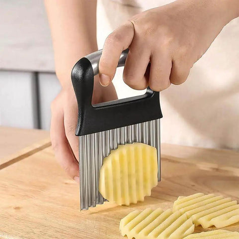 Close-up of Two Pack Stainless Steel Crinkle Cutter with wavy blades slicing potato into crinkle fries, easy grip handle visible.