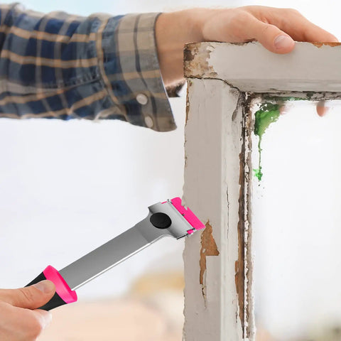 Person using the Pink Razor Scraper Kit With 3 Scrapers And 45 Replacement Blades Including 15 Metal And 30 Plastic Blades for paint removal