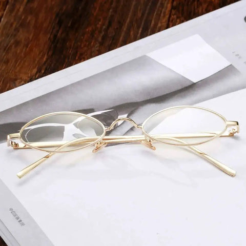 Vintage Oval Sunglasses For Men And Women Retro Metal Frame Sun Glasses With Clear Lenses UV400 Protection on magazine