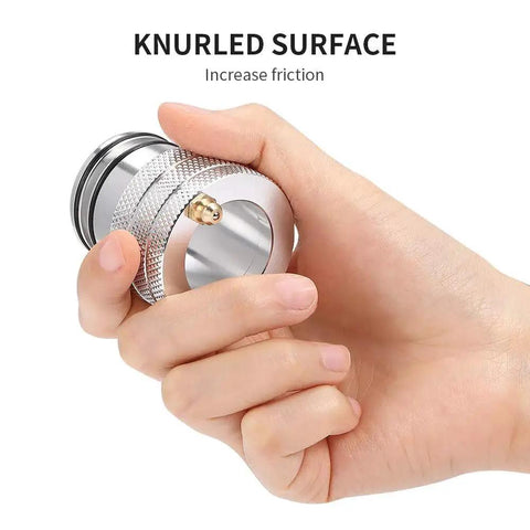 Hand gripping 39mm Wheel Bearing Grease Tool for Can Am Maverick X3 and X3 Max Turbo RR 2017-2026, showing knurled surface for friction.