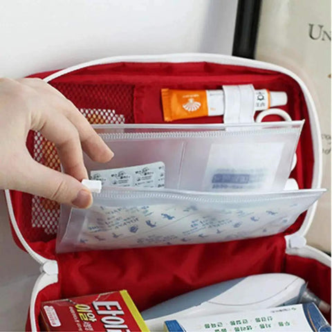 Open Go-To First Aid Bag For Home And Outdoor Adventures showing interior pockets with medical supplies, red polyester material.