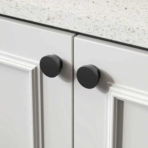 18 Pack Black Cabinet Knobs Zinc Alloy Round Drawer Knob 1-5/8 Inch installed on white kitchen cabinet doors