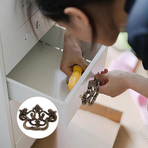 Person installing 6 Pack Antique Drawer Pulls For Dresser And Cabinet, Vintage Bronze Finish 4 Inch Handles on white drawer