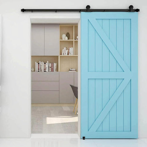 Interior view of a blue barn wood door mounted using a Five And Half Foot Sliding Barn Door Hardware Kit With Adjustable Floor Guide And Top Mount Track For Barn Wood Doors Durable Steel Construction With Nylon Wheel Hangers For Smooth Quiet Operation Frosted Black Finish Fits One And Three Eighths Inch Doors in home study.
