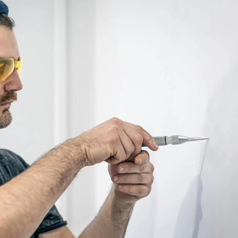 Person using Spring Loaded Center Punch Marker For Wood Metal Plastic With Palm Cushion Cap 5 Inch Automatic Scriber Tool on wall