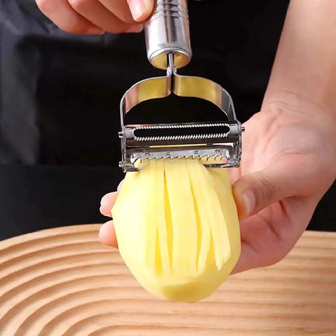 Hand using 2 Pack Crinkle Cutter And 2 In 1 Vegetable Peeler Set With Stainless Steel Blades on potato for julienne cuts