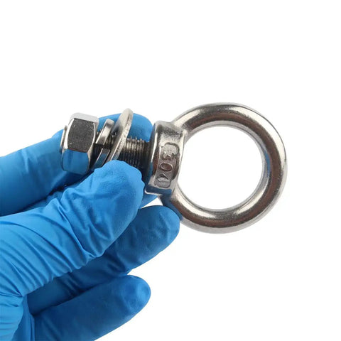 Gloved hand holding an eye bolt with nuts and washers, part of the 4 Pack 3/8 X 1 Eye Bolts With Nuts Stainless Steel Heavy Duty Eyebolts M10x25mm Threaded For Rigging And Hoisting Corrosion Resistant 304 Stainless Steel Includes Nuts Flat Washers And Spring Washers.