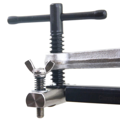 Strong Hand Tools CPL45 pipe fit-up clamp, steel, for 2–4 in pipe, close-up of wing-nut bolt and T-handle.