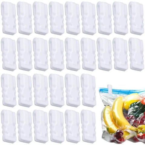 30 Pack Vacuum Storage Bag Sealing Clips Quick Snap Zipper Grips, white plastic clips, arranged beside sealed vacuum storage bag with fruit.