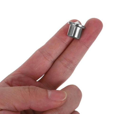 Hand holding a metal piece from the 8 Piece Dowel Center Pin Set With Precision Point For Woodworking Drilling And Hole Alignment