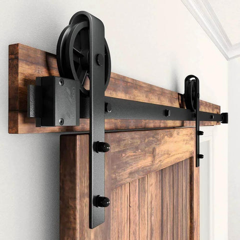 Heavy Duty Sliding Barn Door Hardware Kit Black 6 Ft Track System With Silent Glide Wheels installed on wooden door