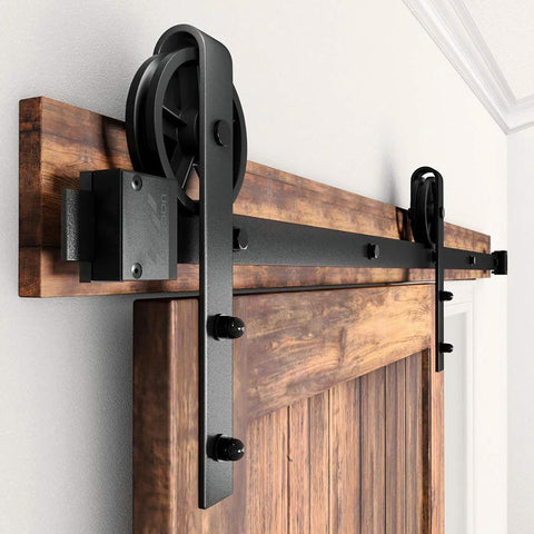 Side view of Beefy Adjustable 5 To 16Ft Wood Sliding Barn Door Hardware Kit with 8Ft Basic Black Flat Track System Big Spoke Wheel Rollers.
