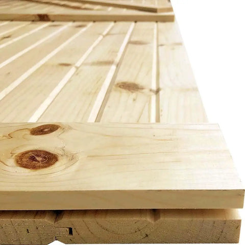 Close-up of an Unfinished Solid Pine Core Interior Barn Door Slab DIY Kit 84 In By 18 In, beaded design ready to paint.