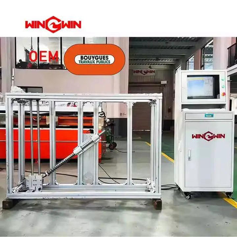 Metal frame structure with hydraulic component next to control panel in industrial setting
