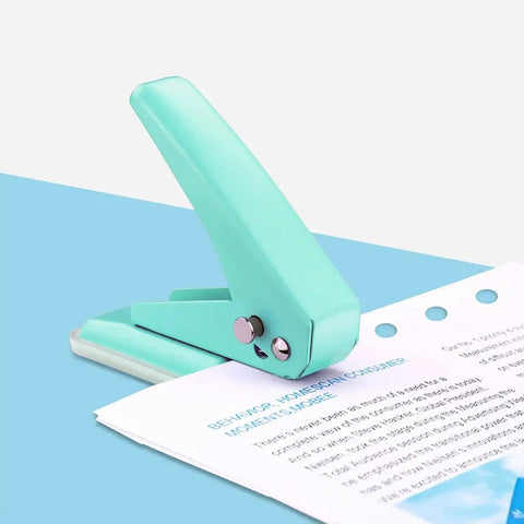 Grab And Go Handheld One Quarter Inch Hole Punch For Up To Twenty Sheets, Metal Hole Puncher, green on blue surface with paper
