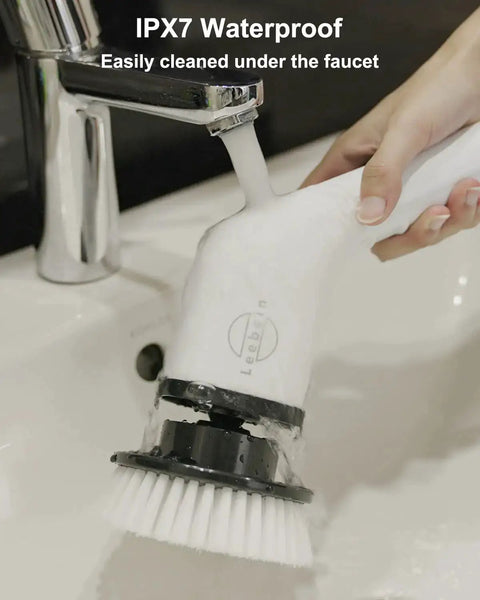 Person cleaning Cordless Electric Spin Scrubber With 8 Replaceable Heads under running faucet, showcasing IPX7 waterproof feature.