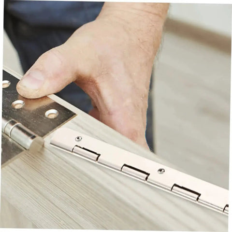 Person installing Heavy Duty Piano Hinge Set OUNONA 30 Piece for Cabinets and Jewelry Boxes With 180 Degree Swing and Pre Drilled Mounting Holes High Load Capacity and Durable Steel Construction Built to Last in Everyday Use