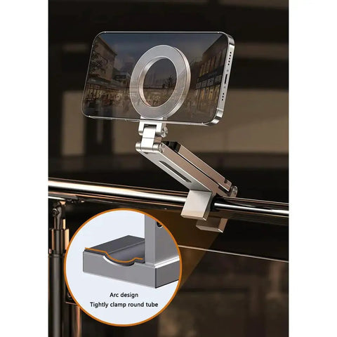 Aluminum Magnetic Phone Tripod For iPhone 12 Through 16 Pro Max Series, mounted on railing, showing 360-degree adjustable clip.