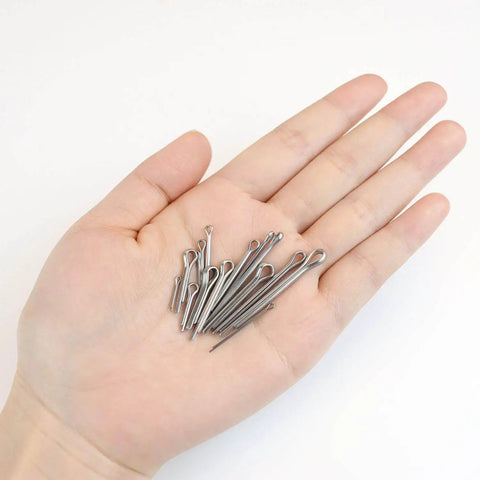 Hand holding assortment from Must Have Automotive Cotter Pin Set 304 Stainless Steel 150 Piece Assortment Kit With 15 Sizes For Mechanics And Engine Repair Corrosion Resistant Split Pins Hardware Clips And Fasteners For Quick Fitting And Secure Assembly