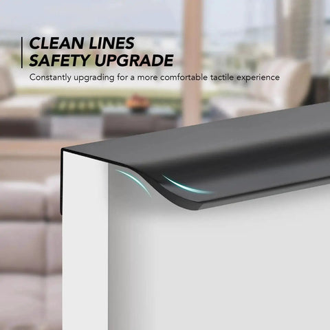 Close-up of a black finger edge pull on a cabinet corner, highlighting the sleek and modern design, with clean lines and safety focus.
