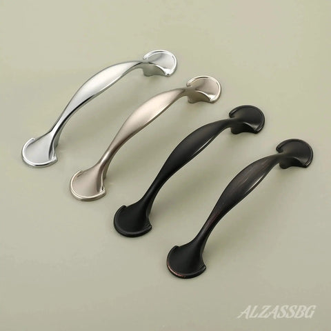 Various finishes of arch style cabinet pulls, showcasing oil rubbed bronze, 3 inch hole centers, solid metal handles for cabinets and furniture