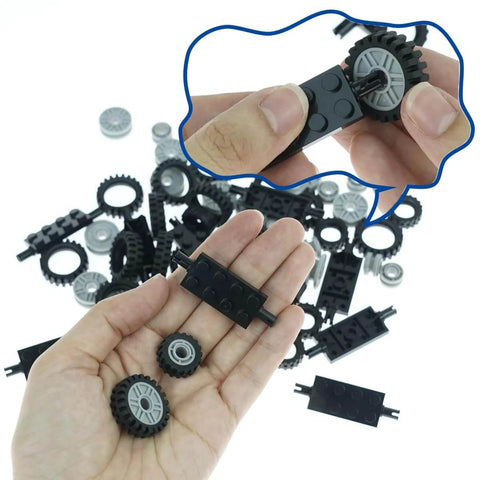 Close-up of hand holding City Car Wheels Tires And Axles Kit Set for Vehicles and Trucks with major brand compatibility.