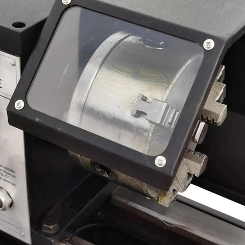 Close-up of Industrial Metal Lathe Machine geared head by TechTONGDA, showcasing 10.2 inch swing, in workshop setting.