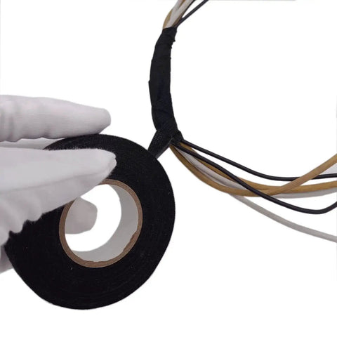 Gloved hand holding Heavy Duty Cloth Electrical Tape For Automotive And Home Use DIY Friendly High Temperature Friction Tape Black