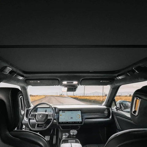 R1S Roof Sunshade Two Piece Full Blackout installed in Rivian R1S interior, blocking light from front and rear roof glass.