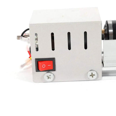 Power switch and motor housing of Handy Compact Wood Lathe For DIY Projects In Your Home Workshop Tabletop Mini Lathe For Wood Turning 24V DC 100W 7 Speeds Aluminum Alloy Acrylic Construction Portable 310x60x70mm Includes 3 Hex Shanks By BACHIN