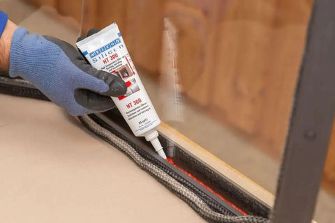 Applying Heavy Duty High Temp Silicone Sealant For Sealing Bonding And Insulating Withstand Up To 572 Fahrenheit Red For Oven Chimney Adhesive In Home And Industrial Use Two Point Eight Ounce to a glass edge.