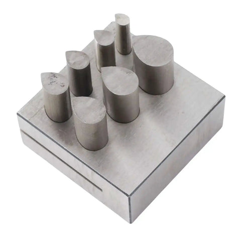 Drop Shaped Die Cutter Set With 7 Pieces In 45 Steel for jewelry making and crafting, shown in steel block with flat bottom punches.