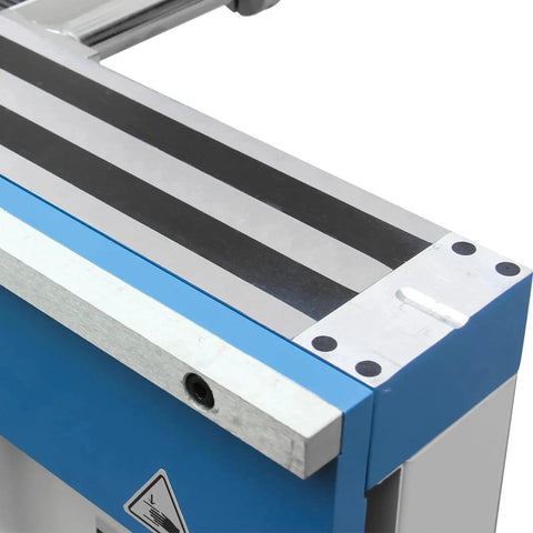Sheet metal brake close-up: blue housing and silver bed with clamp area.