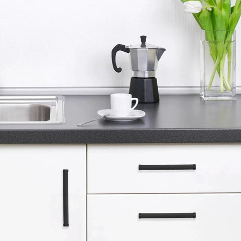 Installed 10 Pack 5 Inch Matte Black Knurled Cabinet Pulls for Cabinets and Drawers in modern kitchen setting.