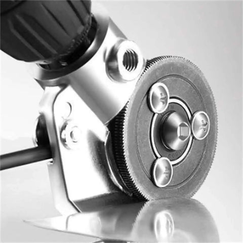 Sheet Metal Cutting Nibbler Attachment For Drills in use with 3/8 or 1/2 inch drill, showing close-up of cutting head on metal sheet