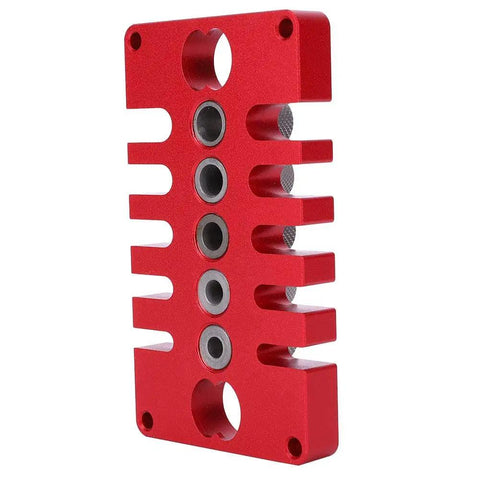 Red Punch Positioner Dowel Jig 3-In-1 Drill Guide Block for woodworking, shown from the side, with aluminum build and precise holes.