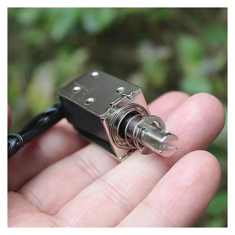 Hand holding DC 24V Linear Push Pull Solenoid Electromagnet Open Frame with 10mm Stroke Plunger for precise actuation