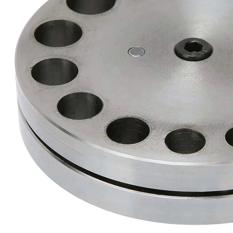 Close-up of Disc Cutter Set With Seventeen Dies for Metal Forming Punch Die Discs showing steel construction for crafting